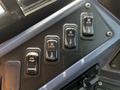 Close-up of control switches for heating functions labeled HTR PUMP RH HTR FRT HTR with a sleek black design