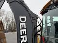 A 2011 John Deere 310SJ 4x4 Wheel Loader Extended Hoe 4 in 1 with a prominent yellow and gray exterior featuring the Deere logo on the side