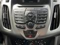Dashboard control panel of a 2016 Ford Transit Connect featuring buttons for radio media and temperature controls