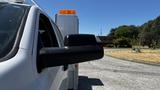 A 2019 RAM 3500 truck with a side mirror partially visible in the foreground