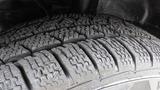 Close-up of a tire from a 2018 Ford Transit showcasing its detailed tread pattern and texture