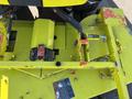 A 2010 Kubota F3990 primarily in yellow featuring a mower deck with noticeable wear and tear, including a motor and various mechanical components prominently displayed