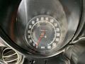 Speedometer of a 1972 Chevrolet Corvette showing a reading of 75675 miles with a red needle indicating speed and a black circular gauge design