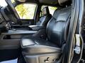 The interior of a 2022 RAM 3500 featuring black leather front seats with a high back design and detailed stitching