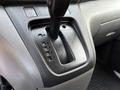 Gear shift panel of a 2021 Nissan NV200 showing positions for park reverse neutral drive and low