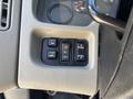 Close-up of the control panel in a 2008 International DuraStar featuring buttons for mirror settings panel lights and other functions