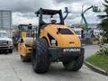 2020 Hyundai HR110C compactor featuring large rear wheels and a smooth roller drum with the Hyundai logo prominently displayed on the back