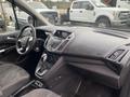 Interior view of a 2017 Ford Transit Connect showing the dashboard gear shift and controls in a gray color scheme