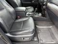 Interior view of a 2021 Toyota 4Runner showing the front seats with black leather upholstery and a central console