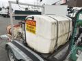 A 2011 Hightliner Aquacide Hot Water Weed Control Dual Flat Deck Trailer featuring a large water tank with a caution sign labeled hot water weed control and a hose attached