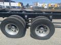 Close-up of a 2008 Peterbilt 340 truck's wheels featuring dual tires with shiny chrome rims and visible tread patterns