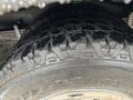 Close-up of a rugged tire tread on a 2020 Chevrolet Express showing deep grooves and textures designed for traction