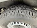 Close-up of a tire on a 2012 Mercedes-Benz Sprinter showcasing the tread pattern and wheel design