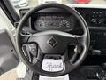 Steering wheel of a 2022 International MV607 truck with dashboard and controls visible