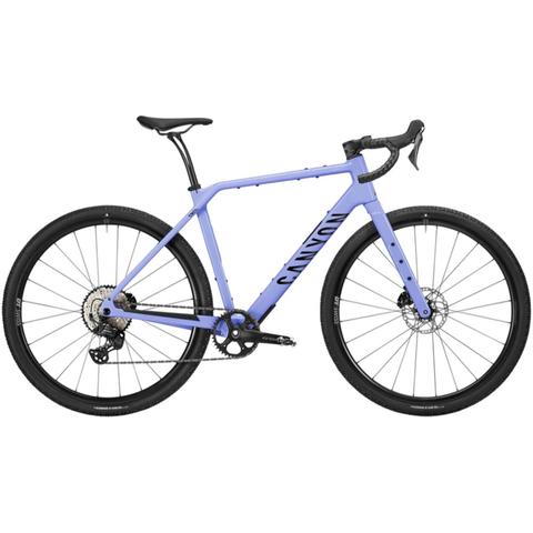 A lavender 2026 Canyon Grizl CF 7 Carbon Adventure Gravel Bike featuring drop handlebars wide tires and disc brakes