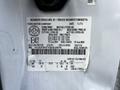 A 2016 Ford F-550 with a vehicle information label detailing specifications such as weight capacities and tire sizes