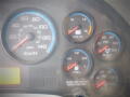 Dashboard of a 2008 International 7400 featuring speedometer fuel gauge volt meter air pressure gauges and warning lights