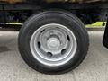 Close-up of a silver wheel with six lug nuts mounted on a 2013 Hino 195 truck tire labeled Conti Scandinavia ED97