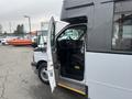 A 2017 Chevrolet Express with the driver's side door open showcasing the interior and driver's seat