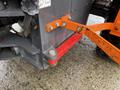 A close-up view of a 2018 Doosan DL300-5 showing a metal frame with orange brackets and bolts attached to a dark gray structure with visible mounting hardware