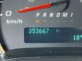 A digital dashboard display showing the odometer reading of 353667 kilometers and the temperature at 18 degrees Celsius in a 2019 Chevrolet Express