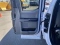 Interior view of a 2019 Ford F-150 driver's side door featuring a gray panel with controls and a handle