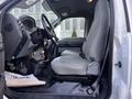 Interior of a 2011 Ford F-750 showing the driver's seat dashboard and steering wheel with controls visible