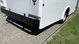 A rear view of a white 2011 Chevrolet Express van showing the bumper and rear lights