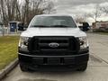 A 2016 Ford F-150 pickup truck facing forward with a black grille and headlights visible