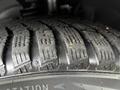 Close-up of a tire on a 2016 Ford Transit Connect showing detailed tread patterns and grooves