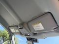 The interior view of a 2023 Ford F-550 showing the overhead console with light controls and a sun visor