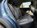 A 2023 Kia Niro EV with a spacious rear seating area featuring leather upholstery and adjustable headrests