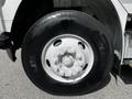 Close-up of a 2012 Freightliner M2 106 wheel featuring a white rim and a black tire with the brand name Michelin and the model XZA2 Energy printed on the side