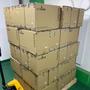 A stack of brown cardboard boxes labeled Antminer containing Bitmain Antminer L9 Litecoin and Dogecoin miners with power supply units