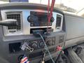 Dashboard of a 2009 Dodge Ram 5500 featuring a stereo system dashboard controls and a keychain with various attachments