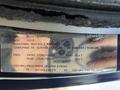 A 2011 Ford Econoline vehicle identification label displaying information such as VIN, weight ratings, and tire specifications