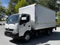 A white 2018 Hino 195 box truck with a silver cargo area and visible headlights parked in a lot