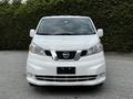 White 2020 Nissan NV200 van with a chrome front grille and rectangular headlights viewed from the front