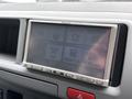 A 2009 Toyota Hiace dashboard displaying a Panasonic audio system with various control options including audio source and volume settings