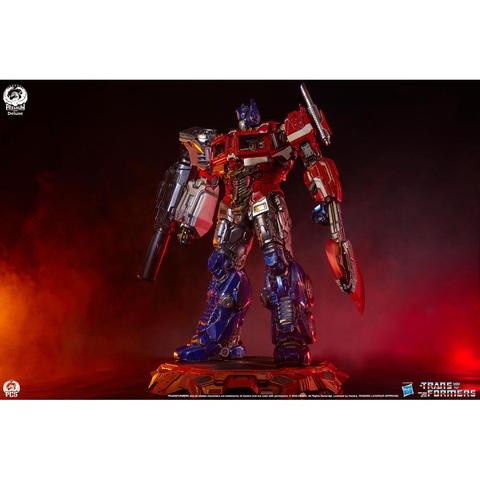 Transformers Museum Scale Optimus Prime Deluxe Edition Limited Edition Statue featuring detailed metallic finish and dynamic pose with various weapon attachments