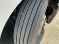 Close-up of a tire on a 2022 Freightliner Cascadia showing tread patterns and wheel bolts
