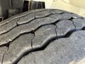 Close-up of a worn tire tread featuring deep cracks and uneven wear pattern on a 2008 International 7500 vehicle