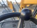 Close-up of the steering wheel of a 2013 JCB 510-56 Loadall showcasing a black spherical knob at the center