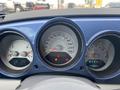 Dashboard of a 2007 Chrysler PT Cruiser featuring speedometer fuel gauge and warning lights
