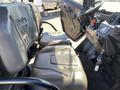 Interior view of a 2018 Kubota RTV-X 1100 C showcasing two seats and the dashboard with controls and a gear shifter