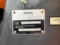 A metal identification plate for a 2018 Doosan DL300-5 loader displaying the model name and product identification number
