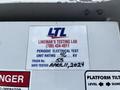 2012 Freightliner M2 106 with a label indicating lineman testing details including periodic electrical test unit rating truck number and test date