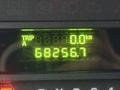 A digital odometer display showing a trip distance of 0.0 km and a total distance of 682956.7 km
