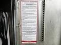 A 2016 Ford F-550 truck showing a safety instruction placard detailing the operating procedure for the Lightning Booster Pak with 12-volt systems