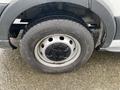 Close-up of a wheel and tire on a 2018 Ford Transit showing the rim with multiple holes and a treaded tire surface